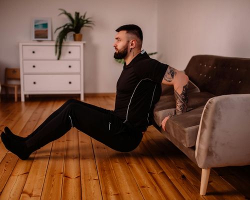 Man focusing on his workout routine in a dark minimalist studio